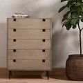 dresser placed in bedroom context with rug, houseplant, and two side lamps styling the space