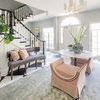 Bench placed in bright entryway with large plant and patterned pillows