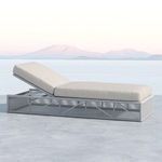 Side view of Miami Adjustable Chaise in light beige cushions with a distant mountain background