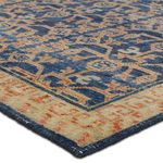 Close-up showing faded vintage effect and worn look on navy and orange wool fibers