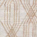 close-up of the rug’s textured jute and cotton weave showing detailed diamond-lattice pattern