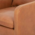 Close-up of Kaya chair armrest stitching and tobacco leather texture