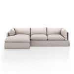 Sectional viewed straight on from front, showing symmetrical cushion arrangement and base skirting