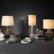 Alexander Hexagon Box shown as part of a styled collection with lamps and decorative vases in a dark room setting.