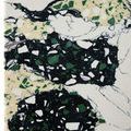 Close-up detail of synthetic stone texture and color pattern in green, black, white, and pale yellow on Fossey Object