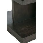 Close-up bottom edge of desk pedestal showing solid wood base and grain pattern