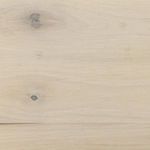 Close-up of mitered corner joint on trunk's light wood surface