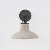 Pottersville Wall Sconce front view showing circular black metal wall plate behind glossy beige ceramic shade