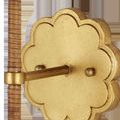 Close-up of gold leaf floral backplate and rope wrapped arm detail