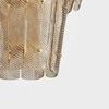 Cassian Chandelier with layered smoked glass panels featuring gold rivets and brass frame