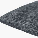 Close-up angle showing the pillow’s plush texture and detailed patterned edging
