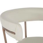 Matlock Stool with white faux leather seat and curved backrest, brass-finished metal legs and back support