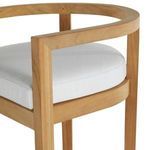 Close-up of cushioned seat showing fabric texture and teak wood frame curvature