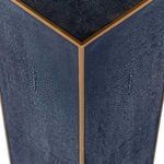 Close-up of gold trim corner detail on the navy blue faux shagreen panels of the Cecil Drinking Table