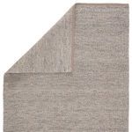 Rug corner flipped to reveal consistent weave and color on backside