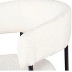 Close-up of boucle fabric texture on Cassia Dining Chair’s backrest showing material detail