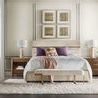 Eleana bed styled in contemporary bedroom with light walls, twin walnut nightstands, bench, and decorative pillows