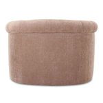 Back view showing low curved back and seamless neutral fabric upholstery of Rosy Sofa