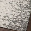 Close-up on hardwood floor capturing textured light grey and ivory pattern with a thin border edge