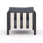 Back view highlighting bronze frame with three vertical white slats and cushioned backrest