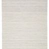 Light gray and cream Torre rug shown laying flat with fringed edges on hardwood floor