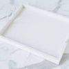 Top view showing clean white interior and round white handles of Bianca Rectangle Tray