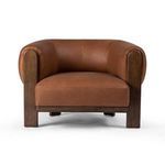 Straight-on front shot with symmetrical armrests and wood legs visible