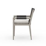 Three-quarter side view showing armrest rope wrapping and cushion thickness