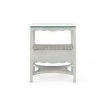 Back view showing solid drawer front and cane shelves on white lacquered side table