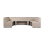 Styled setting with Senna Outdoor Banquette arranged around an oval wooden dining table