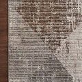 Corner of Austen Stone Bark Rug on dark hardwood floor highlighting pattern transition and color mix
