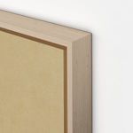 Close-up of raw canvas texture and vertical grain white oak frame corner with light natural wood grain