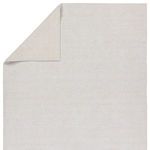 Revealed backing of the rug folded back highlighting flat fabric texture and stitching details