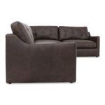 Side profile highlighting smooth side panel and curved backrest on brown leather sectional