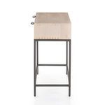 Side profile showing narrow metal frame base and dovetail joinery on tabletop edges