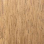 Another angled close-up of cabinet corner showing oak grain and black metal hinge