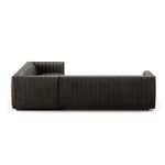 Side view highlighting raised armrest height and channel stitching on the side panel