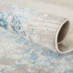 Rolled edge view showing soft viscose blend texture and detailed pattern transitions