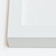 Close-up of matte white frame corner with clean beveled edges