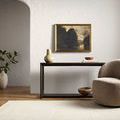 Benchcraft Ivory Sandstone Handmade Rug styled in a minimalist room with beige armchair and console table