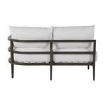 Straight rear view displaying sofa’s two horizontal metal bars on backrest
