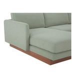Close-up of Vernon sectional armrest with soft rounded edge and wooden base detail