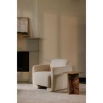 Blair Accent Table by beige upholstered armchair near fireplace in neutral styled living space