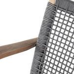 Close-up view from above revealing woven cord pattern and curved armrest shape