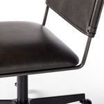 Close-up of Wharton chair seat and lower backrest with smooth dark leather upholstery