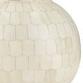 Close-up of rounded base of Osa Drinks Table showing closely aligned ivory colored bone tiles