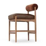 Side angle highlighting thick leather cushion with wooden frame and leg braces
