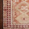 Detailed close-up of the corner border pattern and faded pink and rust color accents on Layla Natural / Spice Rug