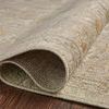 Rolled edge close-up on hardwood floor showing dense, low-height pile and woven backing
