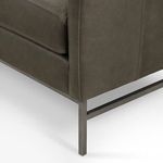 Close-up of sofa’s iron base leg showing matte finish and clean angles